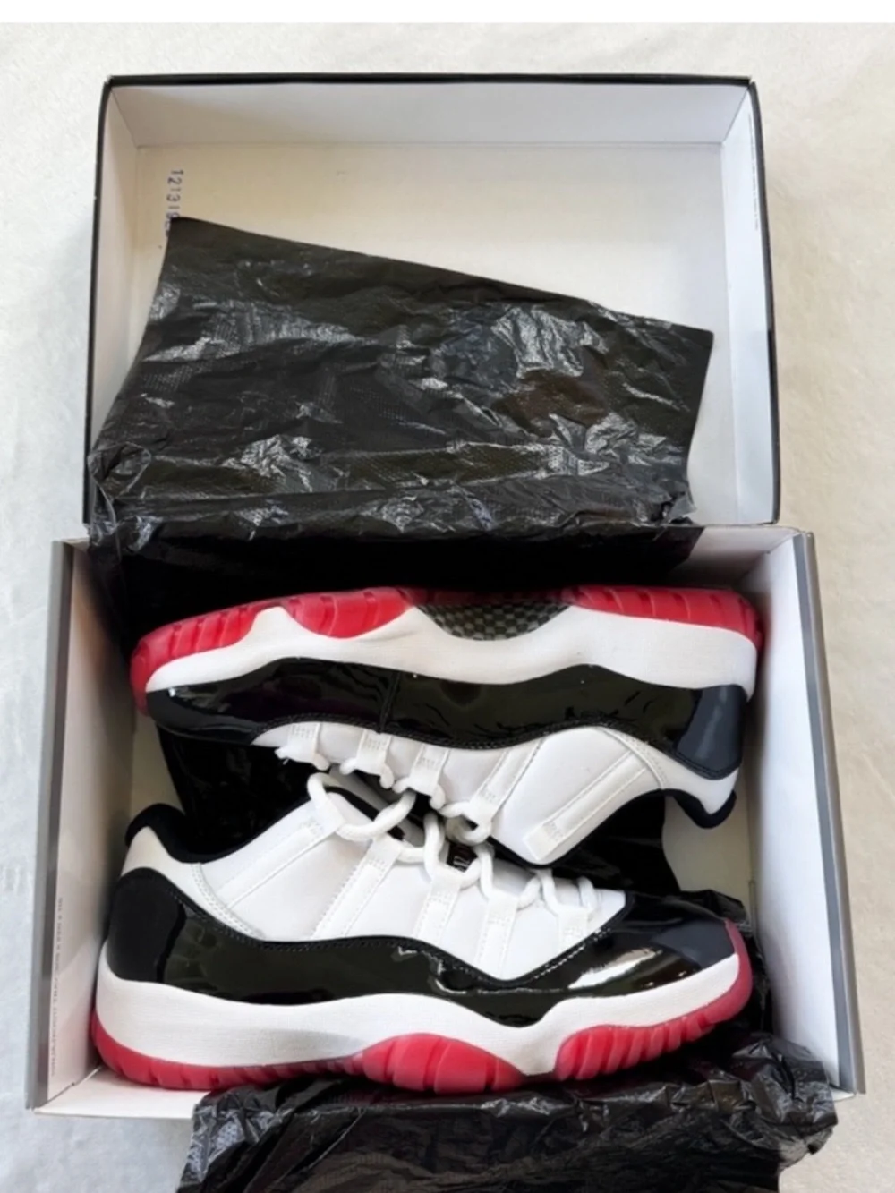 Air Jordan 11 Low Bred Black Red | Men's 8.5